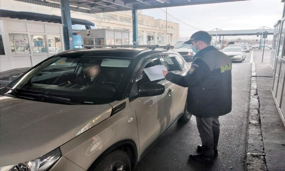     a policeman near a car